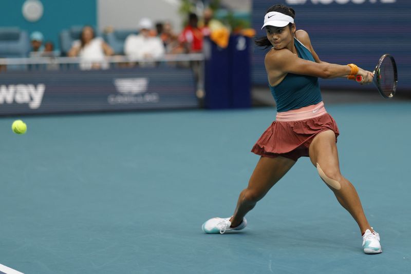 FILE PHOTO: Mar 24, 2022; Miami Gardens, FL, USA; Emma Raducanu (GBR) hits a backhand against Katerina Siniakova (CZE) (not pictured) in a second round women's singles match in the Miami Open at Hard Rock Stadium.
