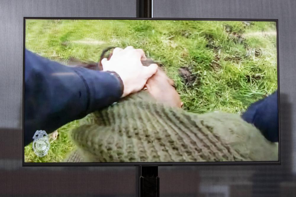 A TV display shows video evidence of a Grand Rapids police officer struggling with and shooting Patrick Lyoya at Grand Rapids City Hall on Wednesday. Lyoya, 26, was shot and killed about 8:10 a.m., on April 4, after what police said was a traffic stop.