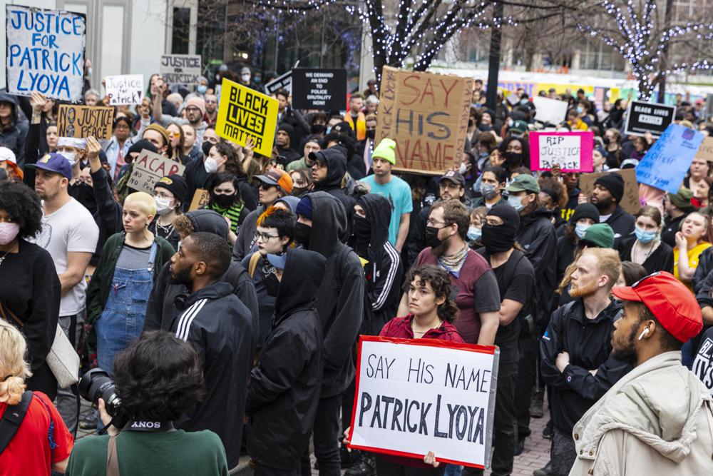 Protesters march along Monroe Center NW after Grand Rapids police released video of the shooting death of Patrick Lyoya in downtown Grand Rapids, Mich., on Wednesday. The 26-year-old Black man was fatally shot by a white Michigan police officer on April 4.