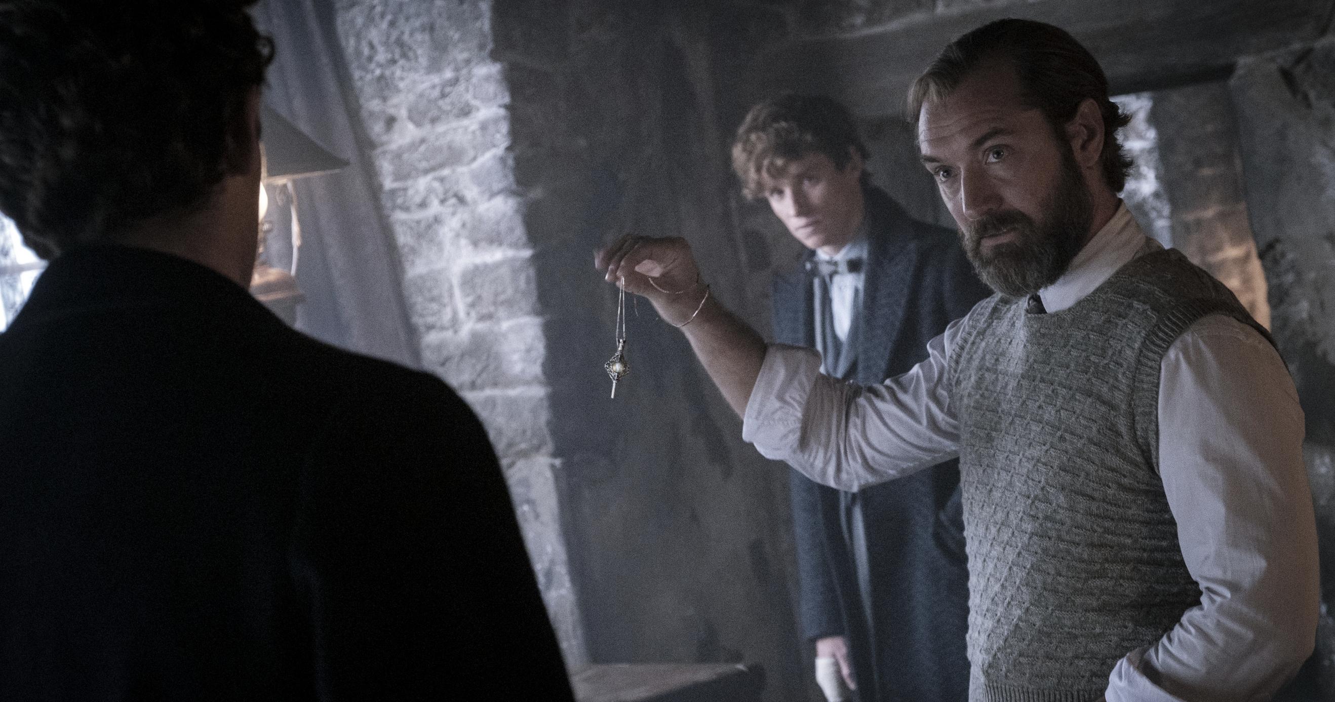 Jude Law, Maria Fernanda Candido, Eddie Redmayne, and Callum Turner in "Fantastic Beasts: The Secrets of Dumbledore."