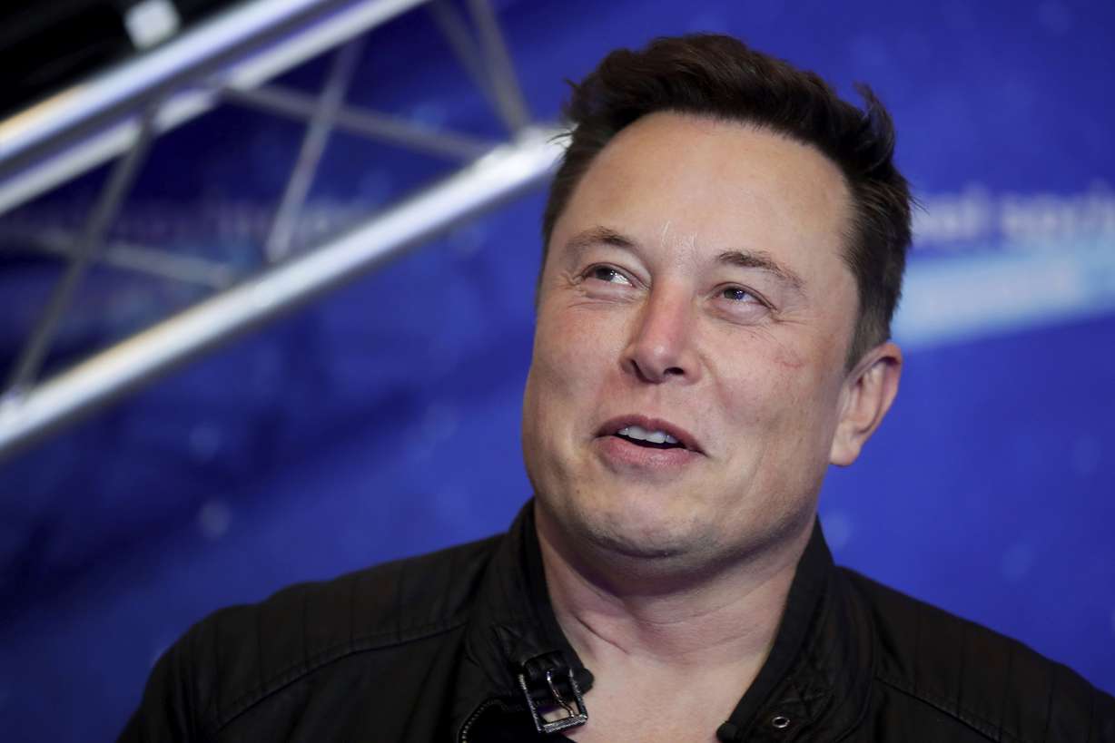 Tesla and SpaceX CEO Elon Musk arrives on the red carpet for the Axel Springer media award in Berlin on Dec. 1, 2020.