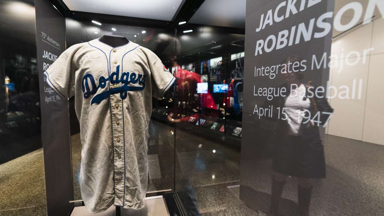 A jersey of Jackie Robinson is displayed at the National Museum of African American History and Culture in Washington, commemorating the 75th anniversary of Jackie Robinson's integration of Major League Baseball, Thursday, April 7, 2022. Robinson became the first African American to play in Major League Baseball breaking the baseball color barrier on April 15, 1947, when he started at first base for the Brooklyn Dodgers.