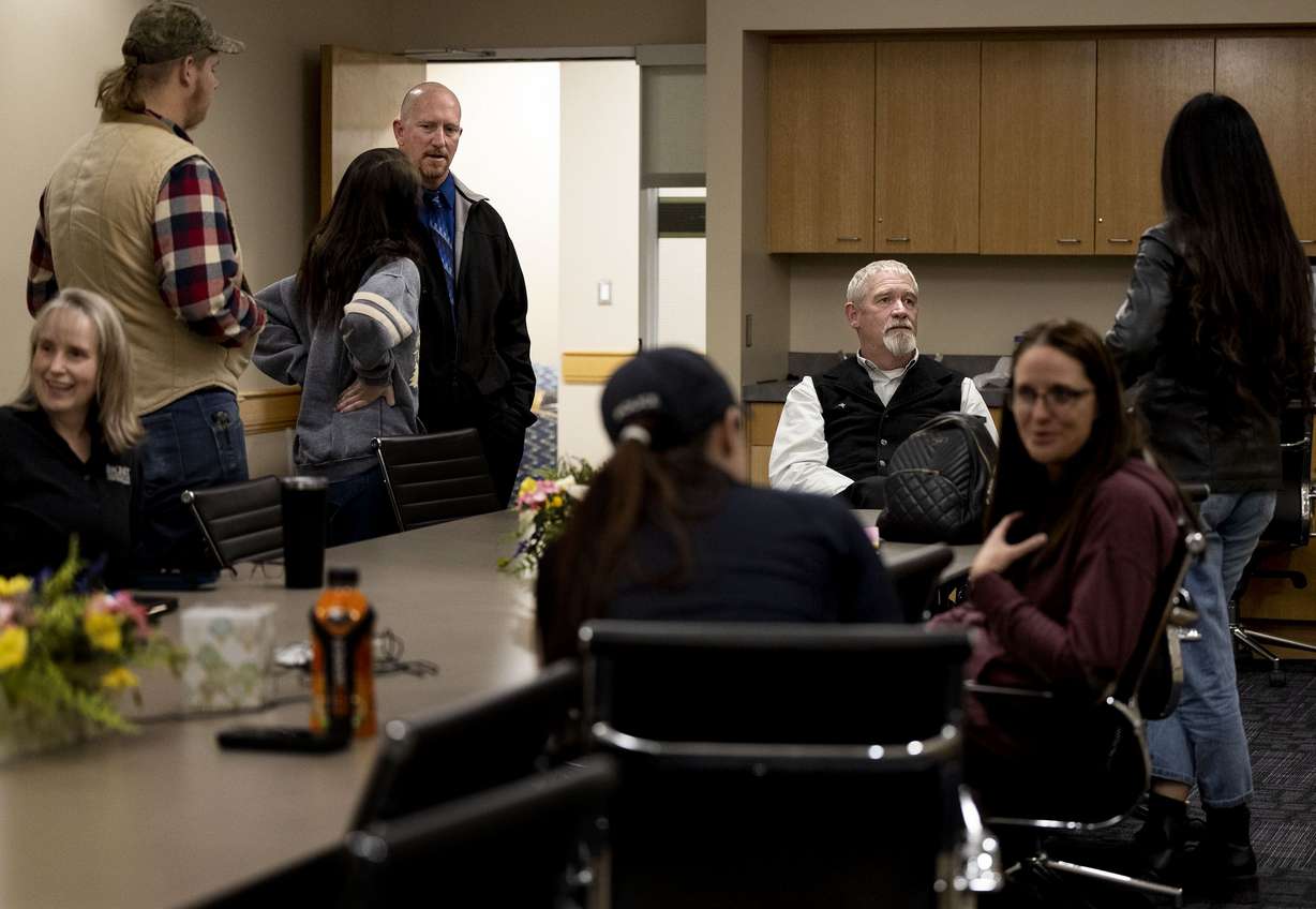 Carbon County Sheriff’s detectives Travis Henrie, second from left, and Wally Hendricks, third from left, meet with volunteers with DontHit.org, a support group for people impacted by sexual assault, at Utah State University Eastern in Price on Wednesday, to discuss how to support victims of sexual assault.