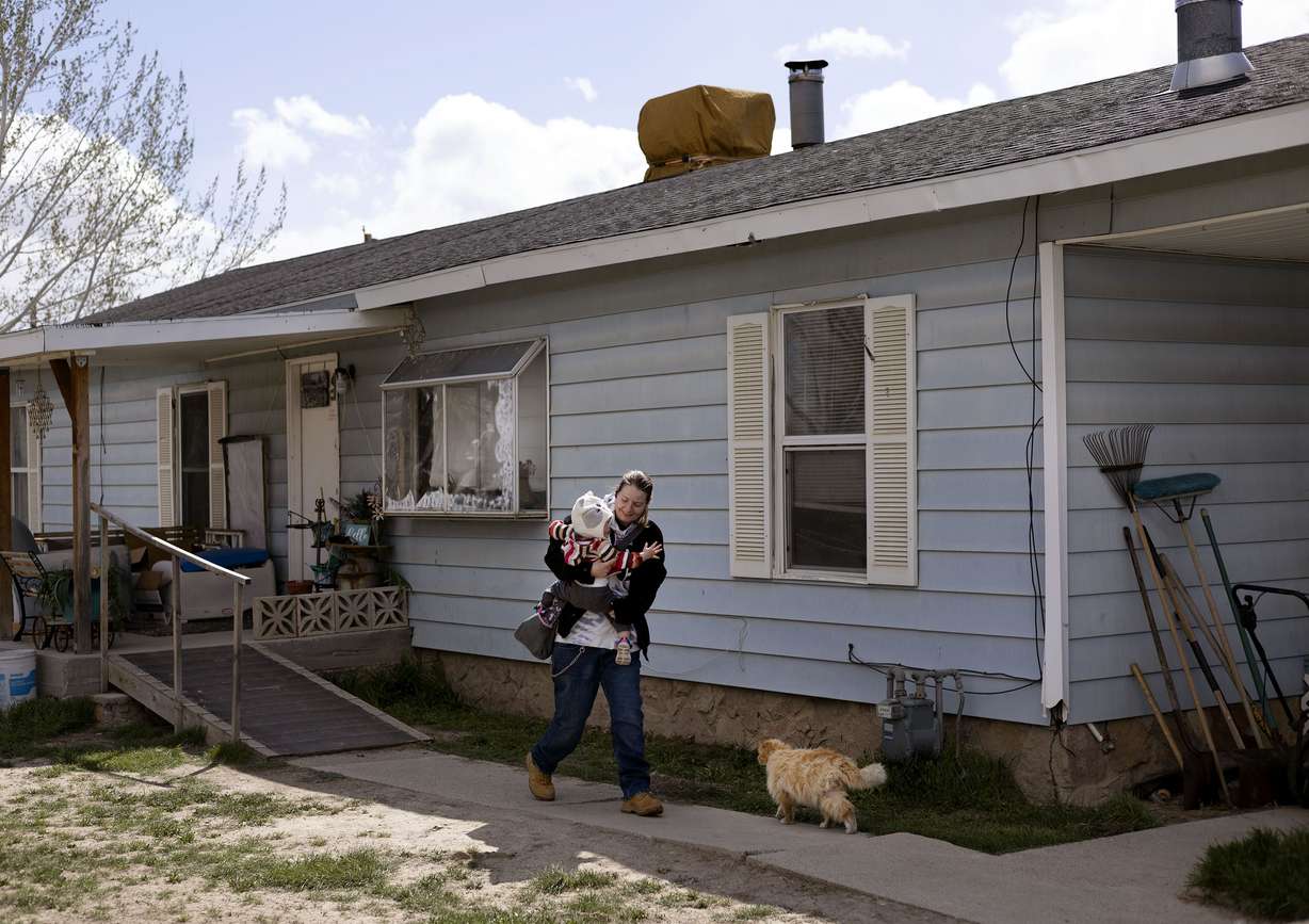 Josie Powell leaves her father’s house in Wellington, Carbon County, on Wednesday. Powell is staying with her father while she looks for a place for her and her daughter to live.