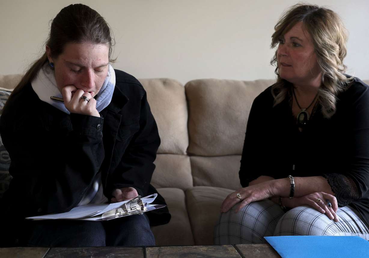 Josie Powell, left, fills out housing and vocational rehabilitation forms with Carbon County victim advocate Denna Fausett in the “soft interview” room at the Carbon County Sheriff’s Office in Price on Tuesday. Powell and Fausett met for the first time in the room three years ago as Powell reported being brutally sexually assaulted by her then-boyfriend. Since then Fausett has become “like family” to Powell.