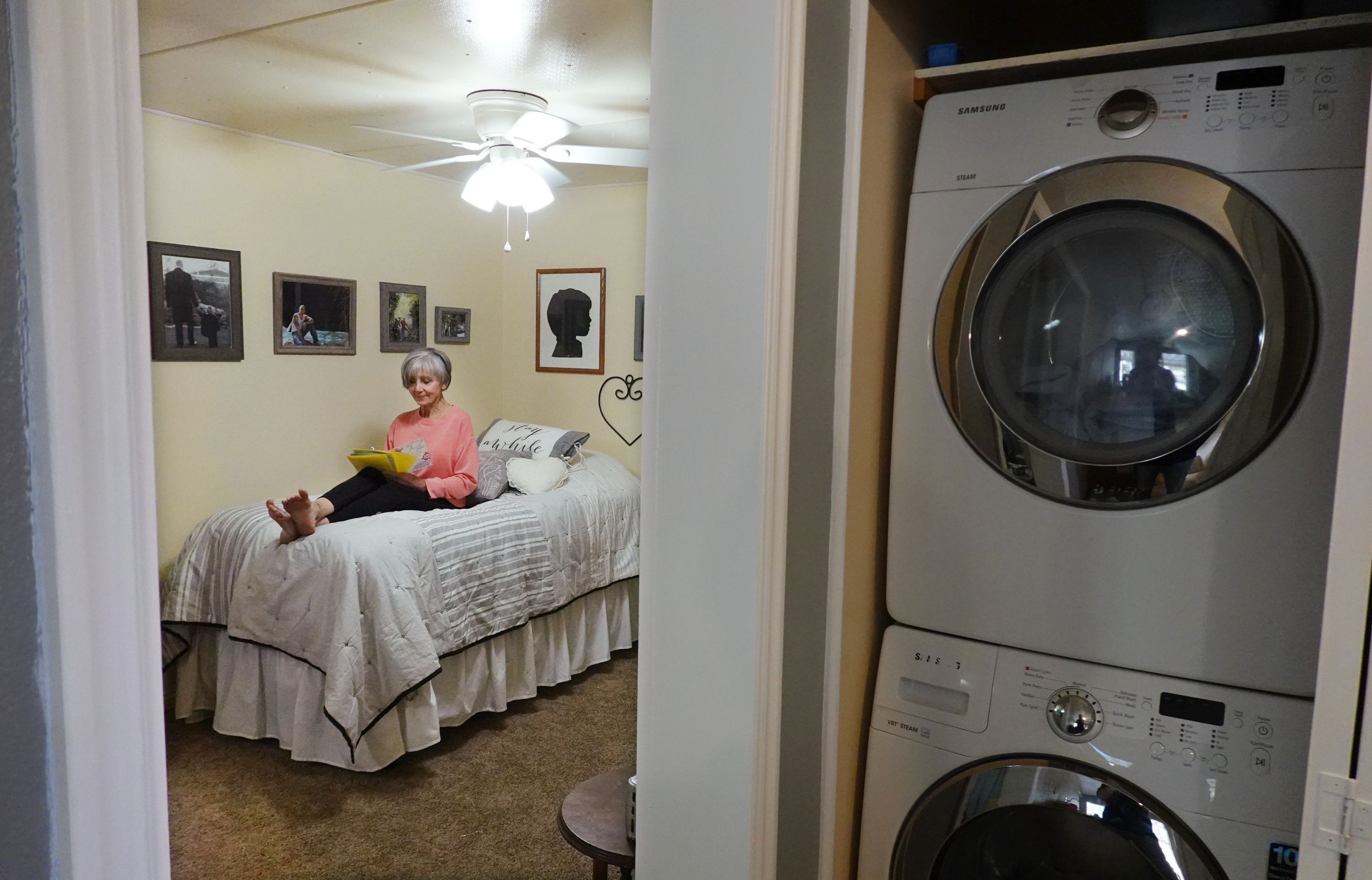 Carrie Smith writes notes on Easter cards at her home in Washington on Thursday. She relies on Utah’s energy assistance program to help pay her home energy bills.