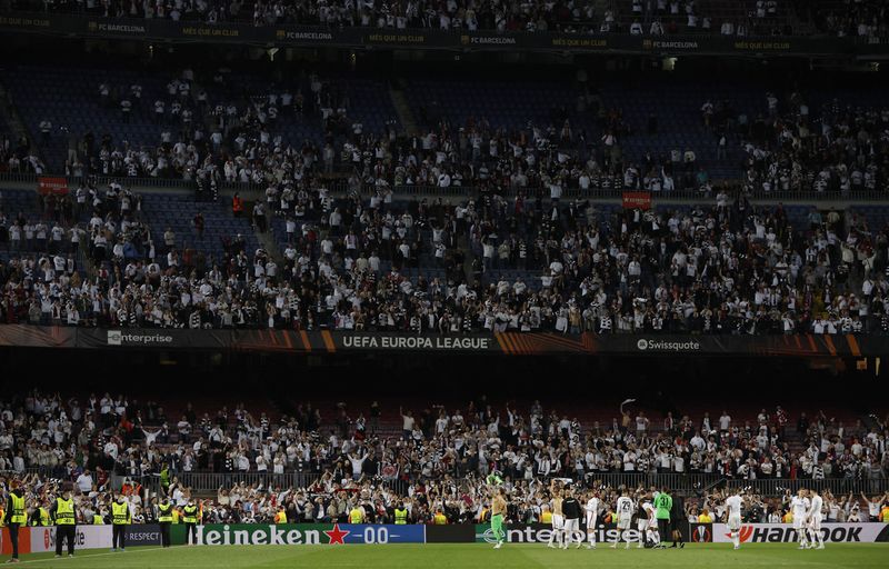 Soccer Football - Europa League - Quarter Final - Second Leg - FC Barcelona v Eintracht Frankfurt - Camp Nou, Barcelona, Spain - April 14, 2022 Eintracht Frankfurt players celebrate in front of their fans after the match