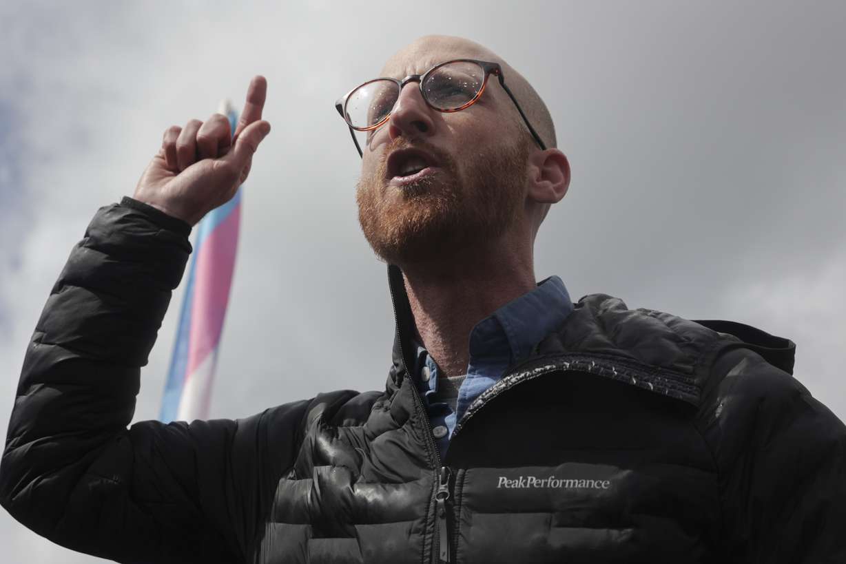Sen. Derek Kitchen, D-Salt Lake City, speaks as East High School students protest the Utah Legislature's passage of HB11, which bans transgender girls from participating in female school sports, at the school in Salt Lake City on Friday.