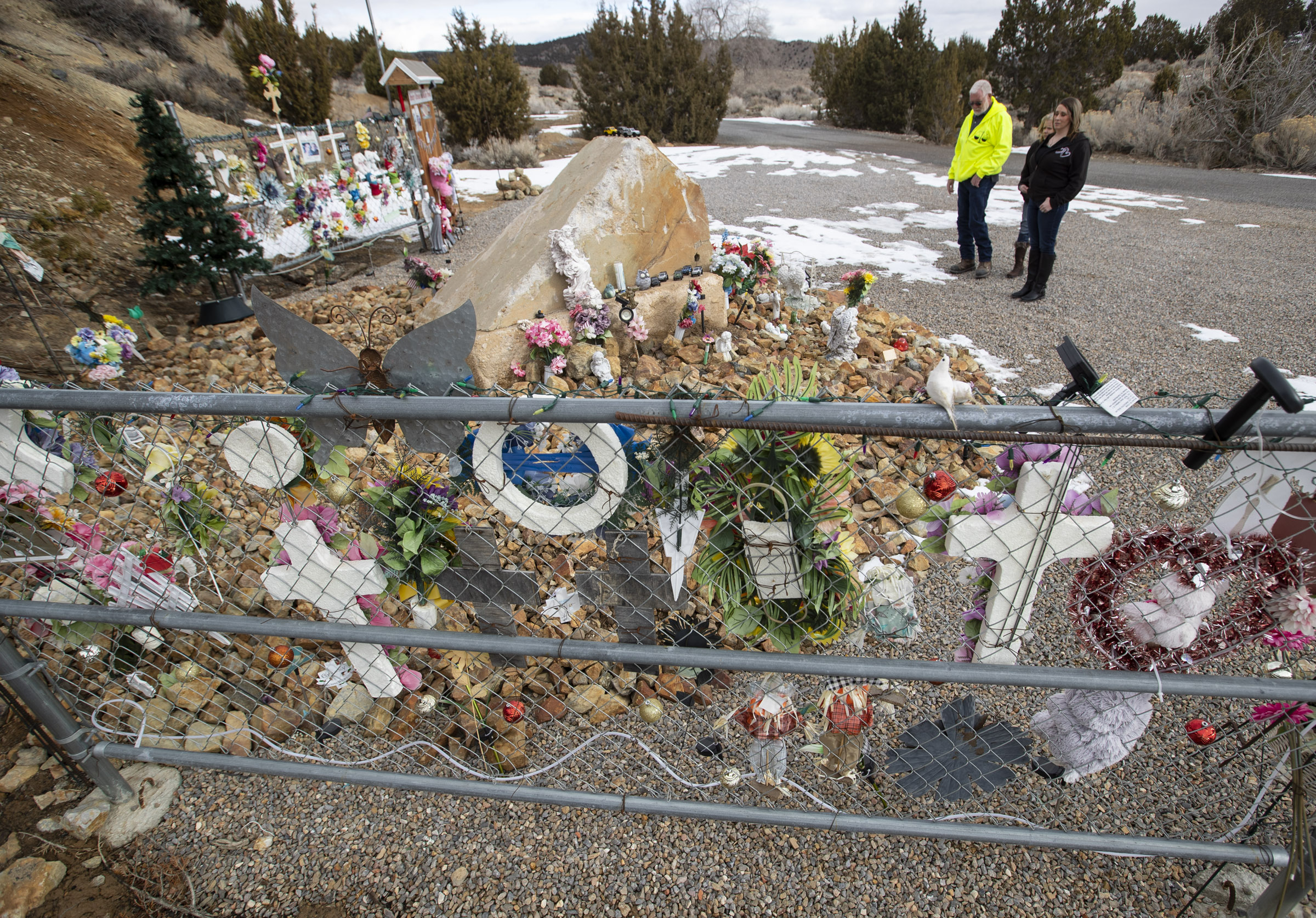 Amanda Hunt, right, visits a permanent memorial for her niece, Brelynne “Breezy” Otteson, and Otteson’s boyfriend, Riley Powell, near the Tintic Standard Mine No. 2 near Eureka, Juab County, on Thursday, Feb. 4, 2021.