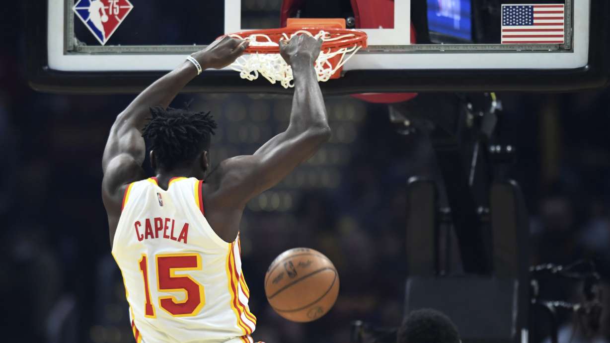 Atlanta Hawks' Clint Capela dunks during the first half of the team's NBA play-in basketball game against the Cleveland Cavaliers Friday, April 15, 2022, in Cleveland.
