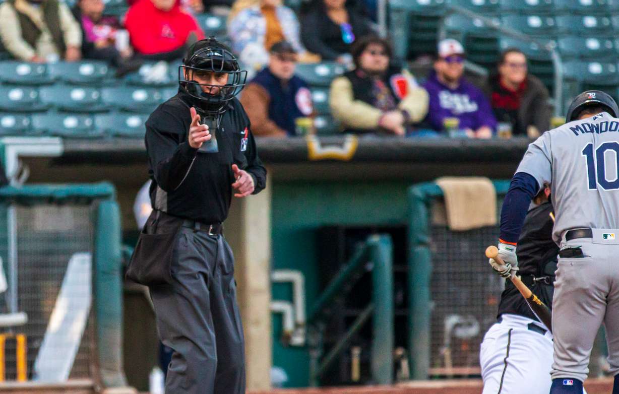 Home plate umpire Darius Ghani calls a strike during a Salt Lake Bees games at Smith's Ballpark on Friday, April 15. Robot strike zones will be implemented at Smith's Ballpark beginning Tuesday.