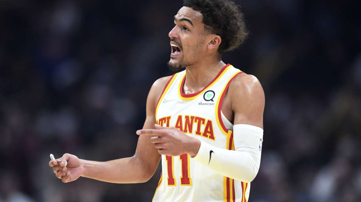 Atlanta Hawks guard Trae Young reacts to a foul call during the first half of the team's NBA play-in basketball game against the Cleveland Cavaliers on Friday, April 15, 2022, in Cleveland.