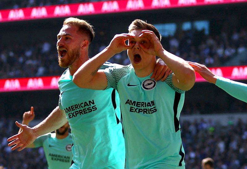 Soccer Football - Premier League - Tottenham Hotspur v Brighton & Hove Albion - Tottenham Hotspur Stadium, London, Britain - April 16, 2022 Brighton & Hove Albion's Leandro Trossard celebrates scoring their first goal with Alexis Mac Allister