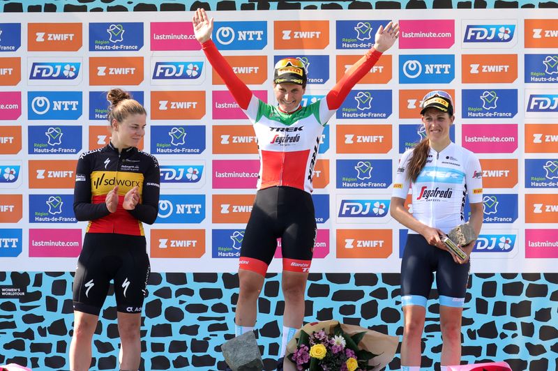 Cycling - Paris-Roubaix Femmes - Roubaix Velodrome, Roubaix, France - April 16, 2022 Trek-Segafredo rider Elisa Longo Borghini of Italy celebrates winning the race on the podium alongside second placed WorldTeam SD Worx rider Lotte Kopecky of Belgian and third placed Trek-Segafredo rider Lucinda Brand of the Netherlands