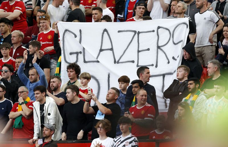Soccer Football - Premier League - Manchester United v Norwich City - Old Trafford, Manchester, Britain - April 16, 2022 Manchester United fans displays a "Glazers Out" banner