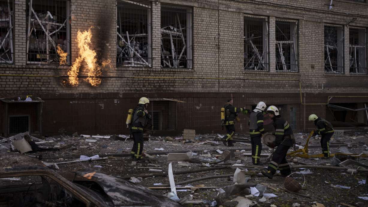 Firefighters work to extinguish multiple fires after a Russian attack in Kharkiv, Ukraine, Saturday.