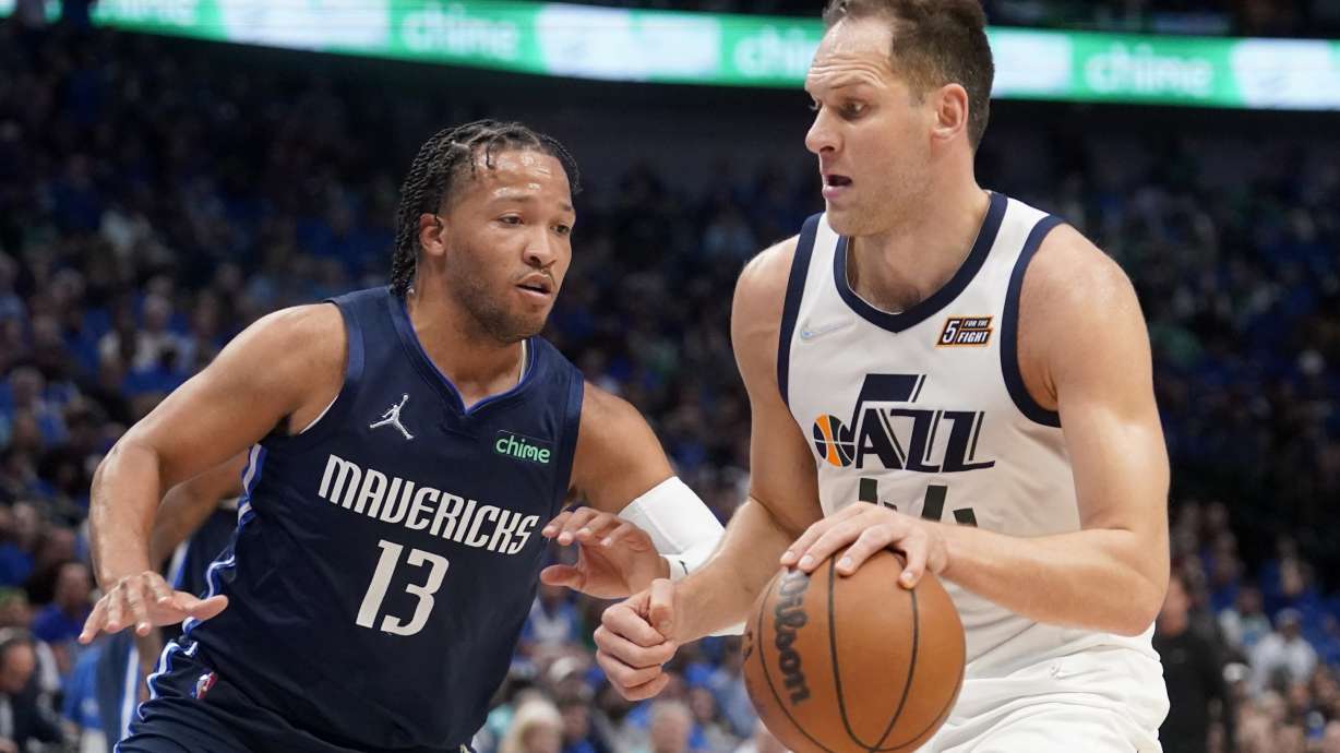Dallas Mavericks guard Jalen Brunson (13) defends as Utah Jazz forward Bojan Bogdanovic (44) works to the basket in the first half of Game 1 of an NBA basketball first-round playoff series, Saturday, April 16, 2022, in Dallas.