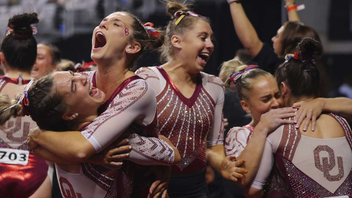 Oklahoma team celebrates their victory together after the NCAA college women's gymnastics championships, Saturday, April 16, 2022, in Fort Worth, Texas.