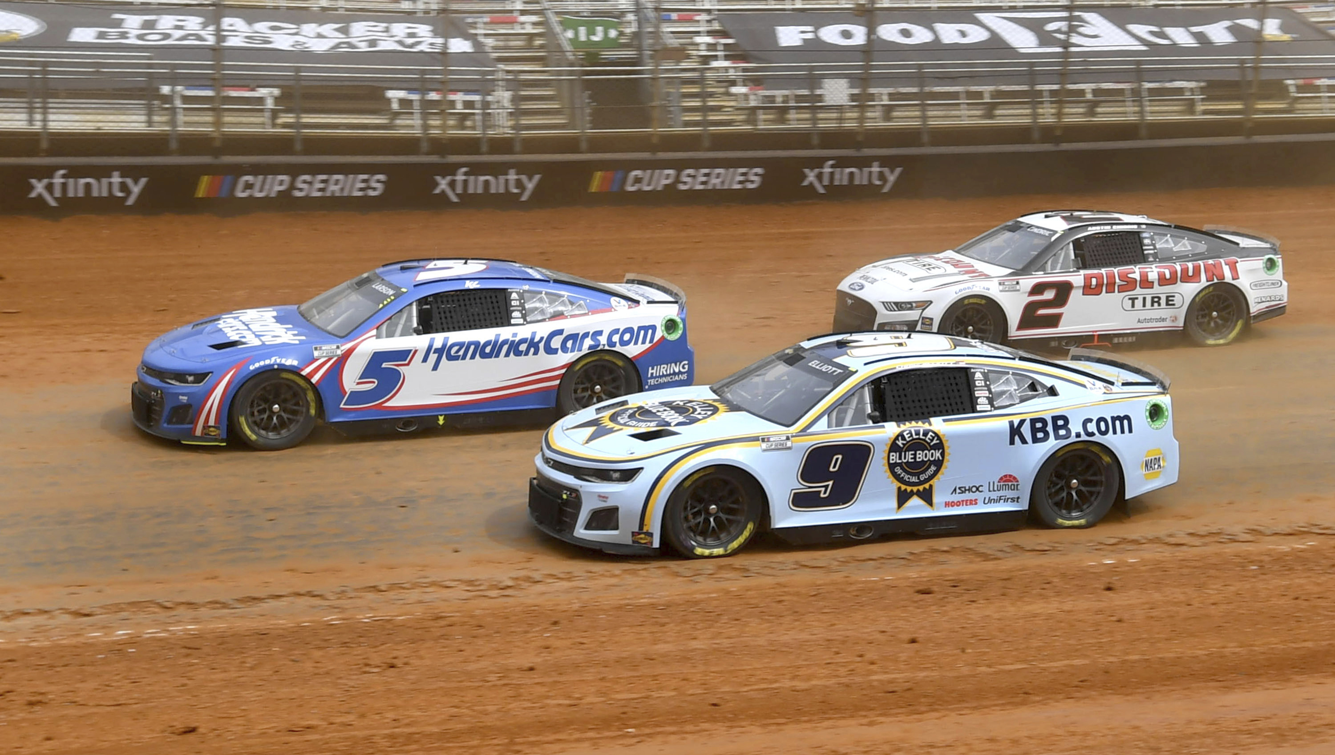 Kyle Larson (5) Chase Elliott (9) and Austin Cindric (2) drive out of Turn 4 during a practice session Friday, April 15, 2022, for Sunday's NASCAR Cup Series auto race at Bristol Motor Speedway in Bristol, Tenn. 