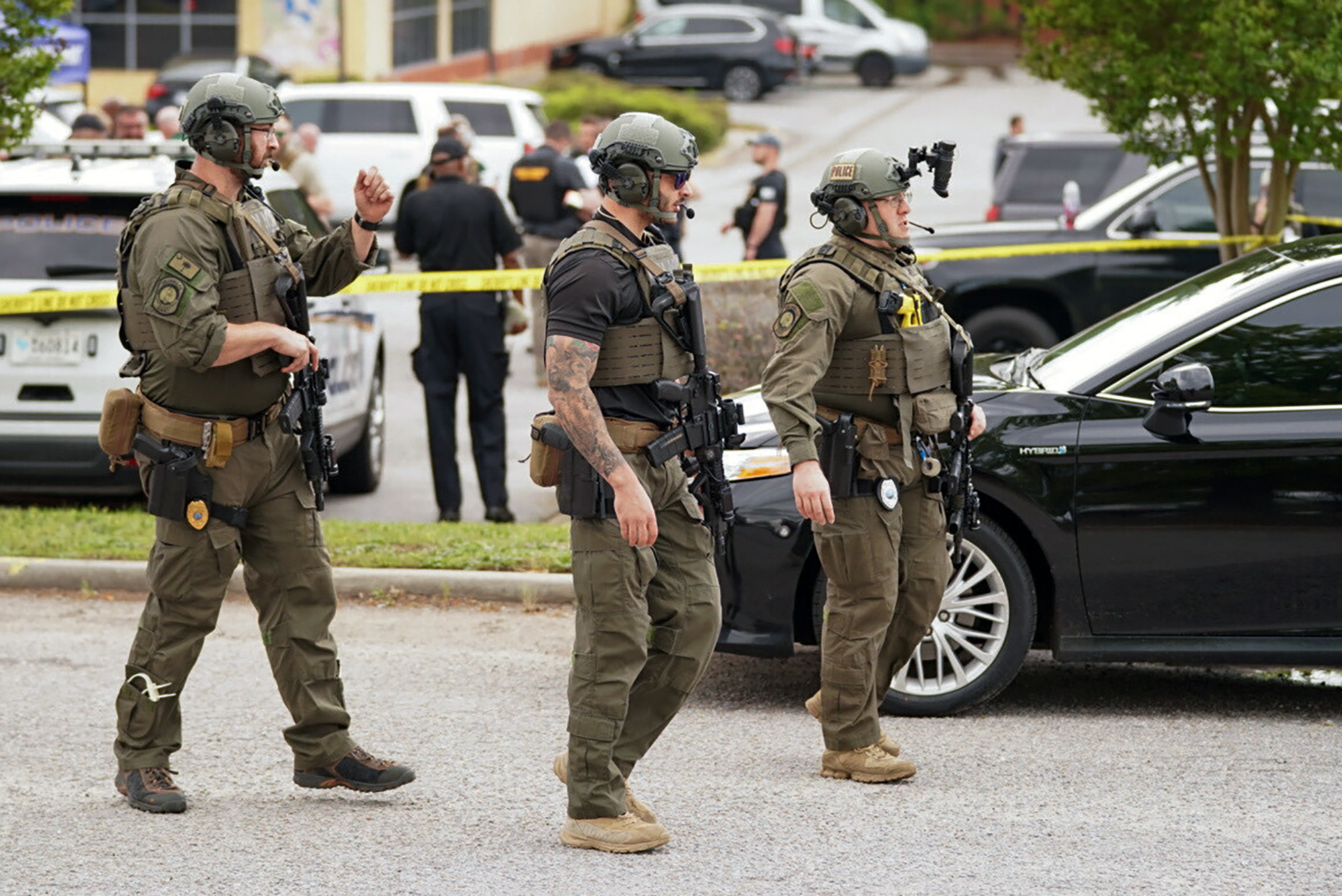 Authorities stage outside Columbiana Centre mall in Columbia, S.C., following a shooting, Saturday.