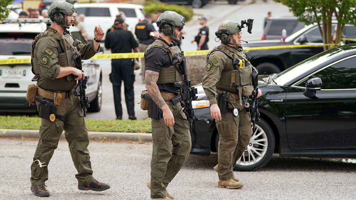 Authorities stage outside Columbiana Centre mall in Columbia, S.C., following a shooting, Saturday.