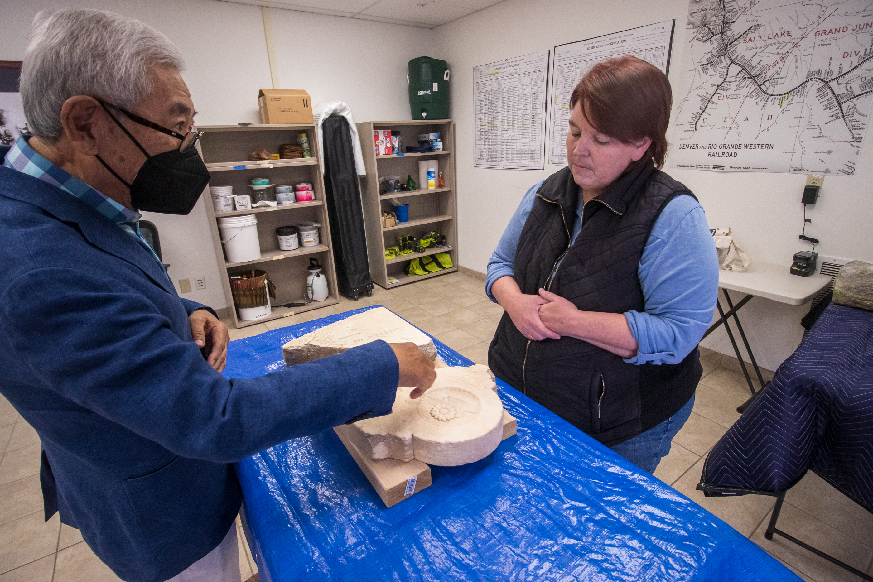 Floyd Mori points to details he notices in a tombstone to Amy Barry before Barry begins cleaning it Saturday morning. The tombstone remembers K. Kawanishi, a Japanese-born railroad worker who appears to have died in southeast Utah in the early 1900s. 