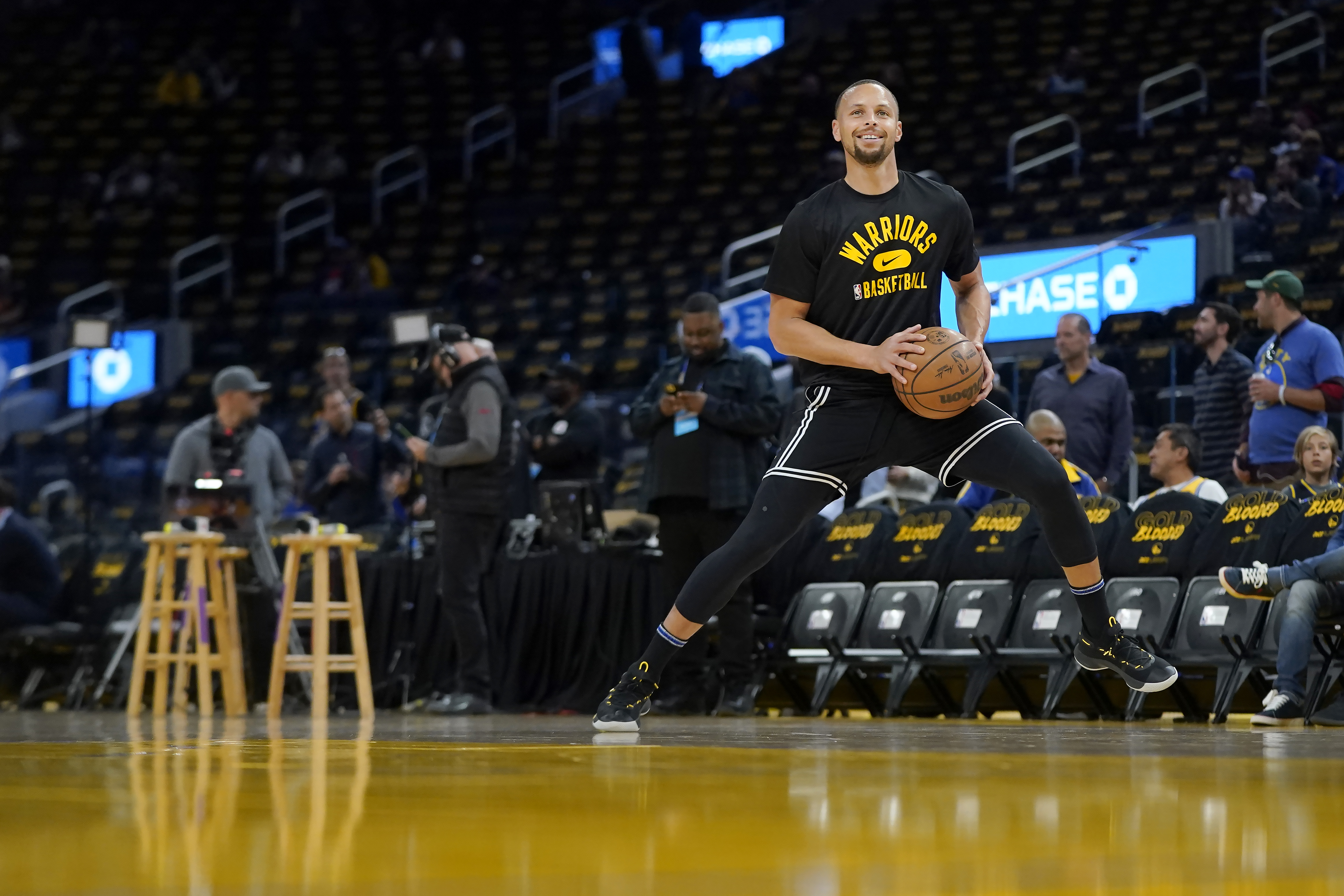 Golden State Warriors guard Stephen Curry warms up before Game 1 of the team's NBA basketball first-round playoff series against the Denver Nuggets in San Francisco, Saturday, April 16, 2022. 