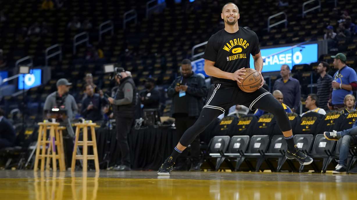 Golden State Warriors guard Stephen Curry warms up before Game 1 of the team's NBA basketball first-round playoff series against the Denver Nuggets in San Francisco, Saturday, April 16, 2022.