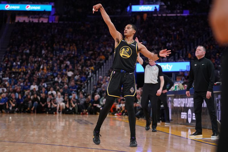 Apr 16, 2022; San Francisco, California, USA; Golden State Warriors guard Jordan Poole (3) follows through on a shot after making a three point basket against the Denver Nuggets in the fourth quarter during game one of the first round for the 2022 NBA playoffs at the Chase Center.