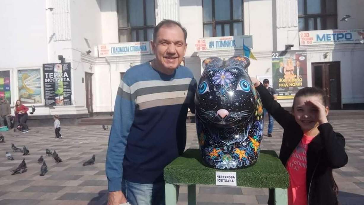 Oleksander Obedinsky with granddaughter Kira, before Russia's invasion of Ukraine. He fears he will never see her again.