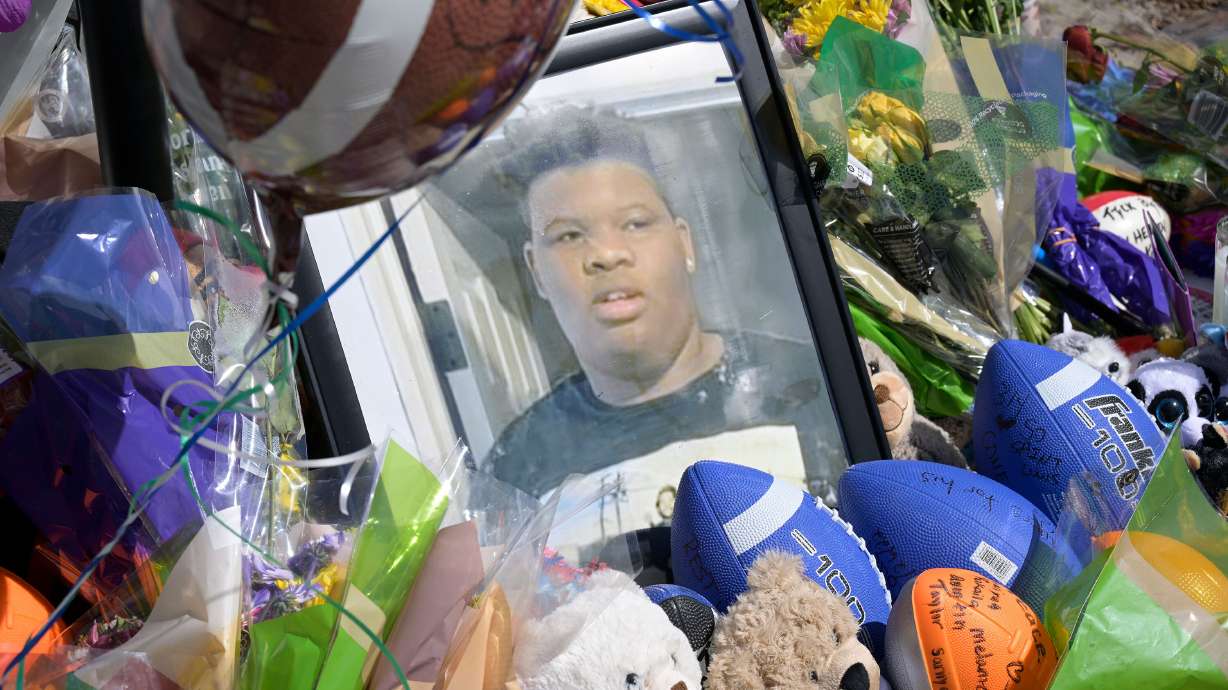 A makeshift memorial for Tyre Sampson is seen outside the Orlando Free Fall ride. Two seats on a ride had been manually adjusted, a forensic engineering firm found Monday.