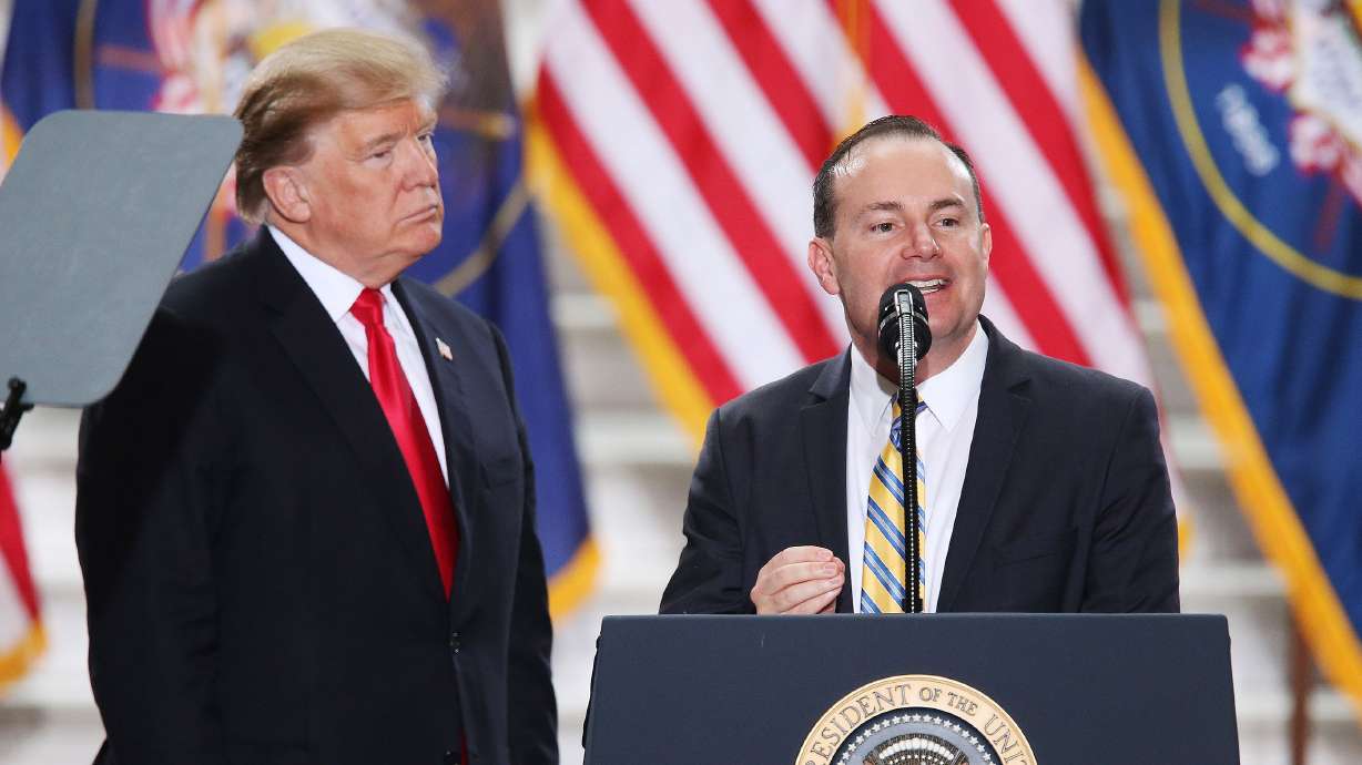 President Donald Trump looks as Sen. Mike Lee, R-Utah, speaks at the Capitol in Salt Lake City on Dec. 4, 2017. Trump endorsed Lee a couple of weeks ago, but the Utah Republican’s reelection campaign hasn’t made a peep about it.