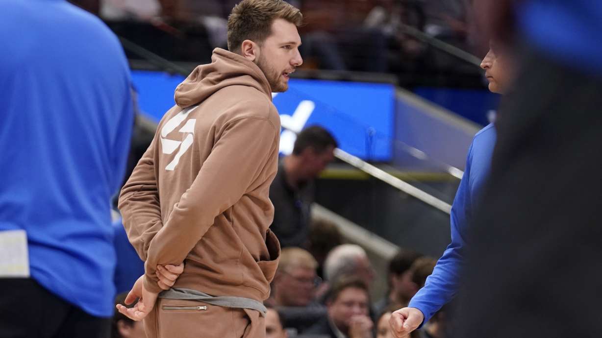 Dallas Mavericks guard Luka Doncic stands on the court during a timeout in the first half of Game 2 of an NBA basketball first-round playoff series against the Utah Jazz, Monday, April 18, 2022, in Dallas.