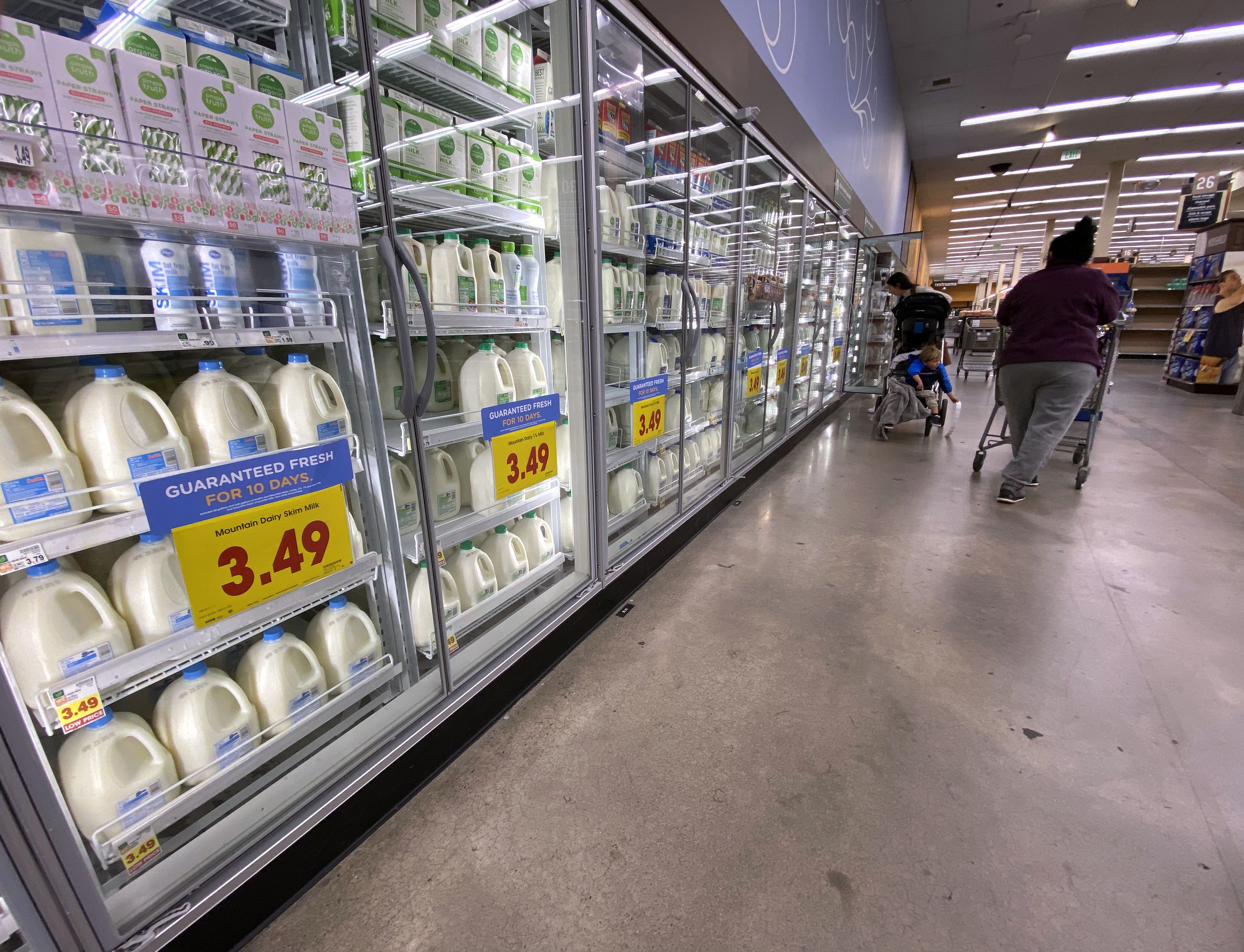 Shoppers browse for items in the dairy section of a local grocery store in Salt Lake City on April 11. Record-high inflation, an out-of-control housing market and the multitrillion-dollar federal deficit all figure into Utahns’ top picks for issues they want to see Congress address on a priority basis.