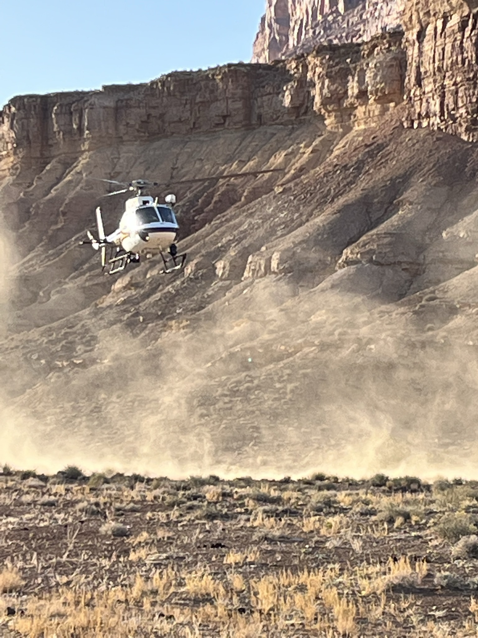 A rescue helicopter is pictured in the Upper Black Box area of San Rafael Swell. Authorities described a "tragic" Easter weekend in Emery County after two men died from falling in separate incidents at San Rafael Swell.