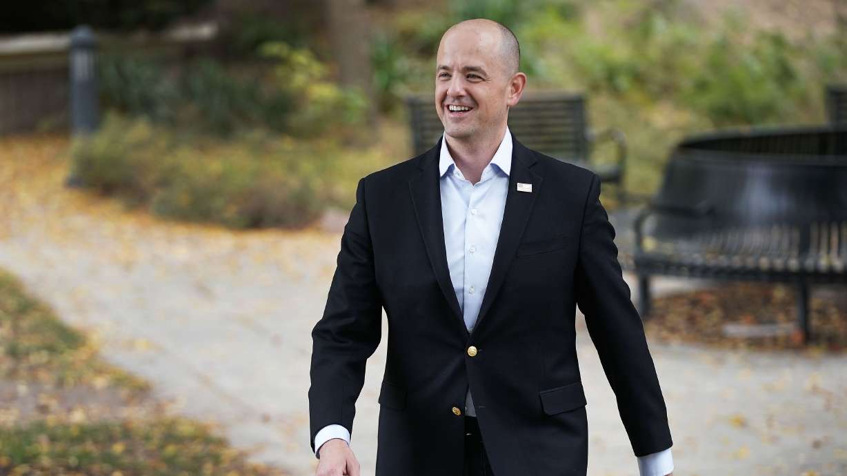 Evan McMullin walks back to his car after an interview in Salt Lake City on Oct. 5, 2021. McMullin is running for Republican Sen. Mike Lee’s seat as an independent.