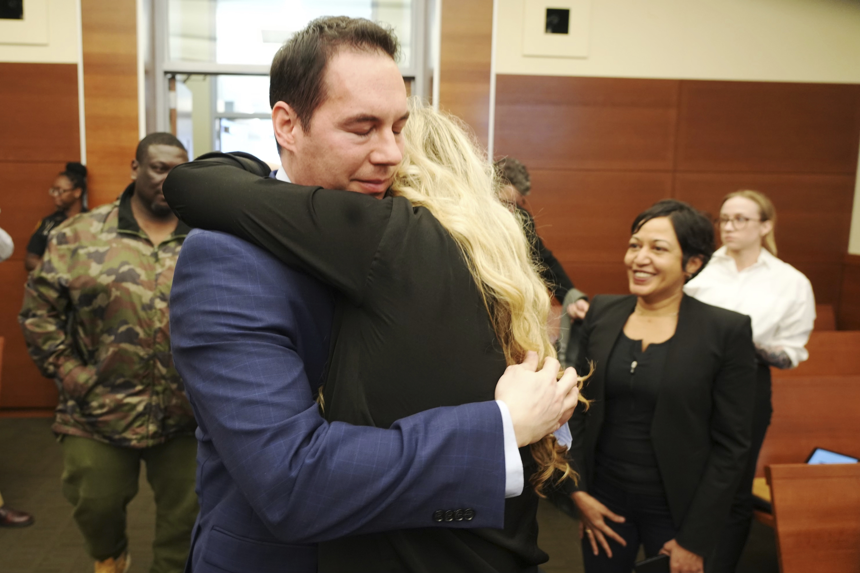 Former Mount Carmel Health doctor William Husel hugs his wife, Mariah Baird, after he was found not guilty on 14 counts of murder in connection with fentanyl overdose deaths of former patients on Wednesday in Columbus, Ohio.  
