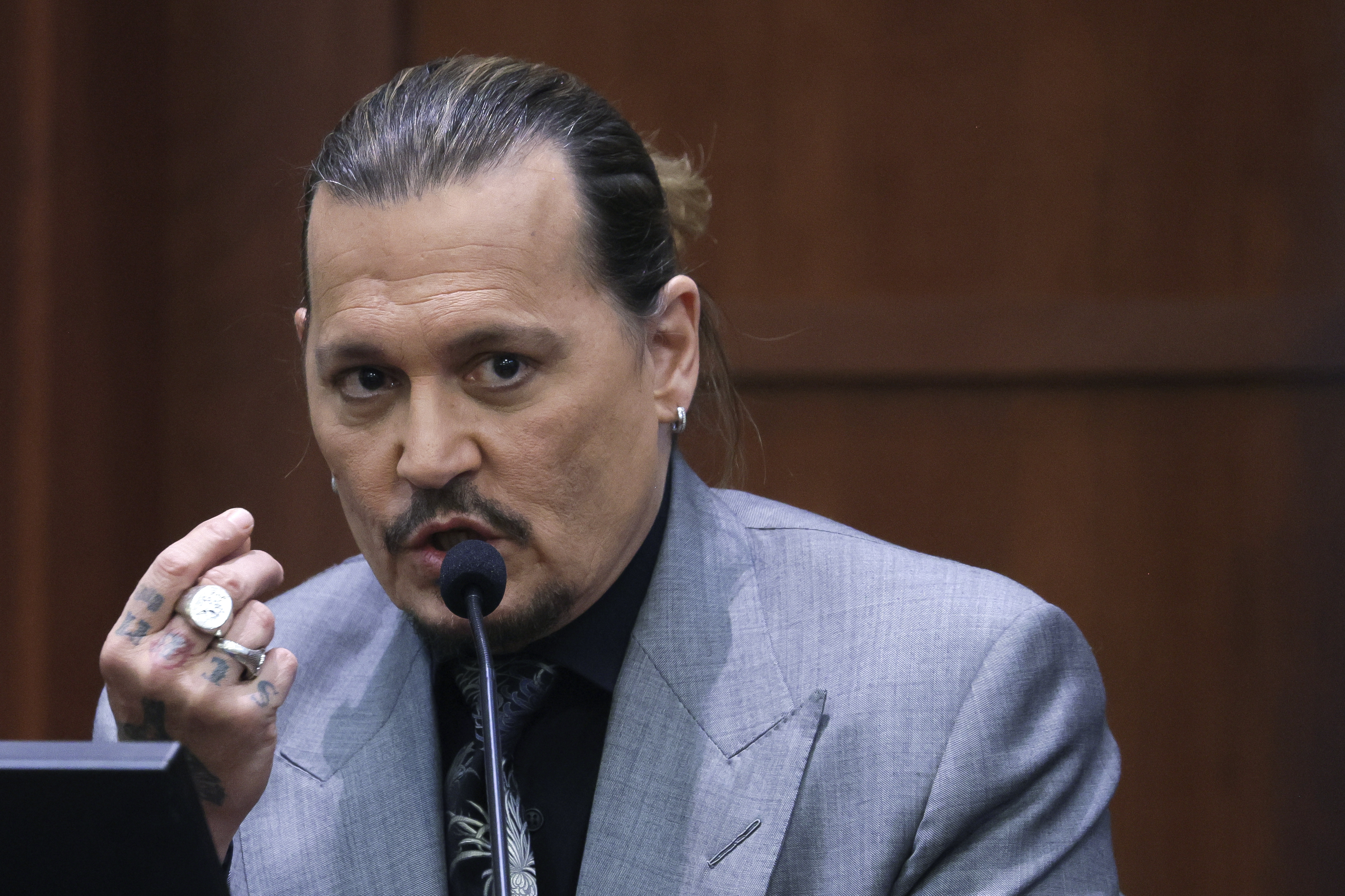 Actor Johnny Depp testifies during a hearing in the courtroom at the Fairfax County Circuit Court in Fairfax, Va., Wednesday.