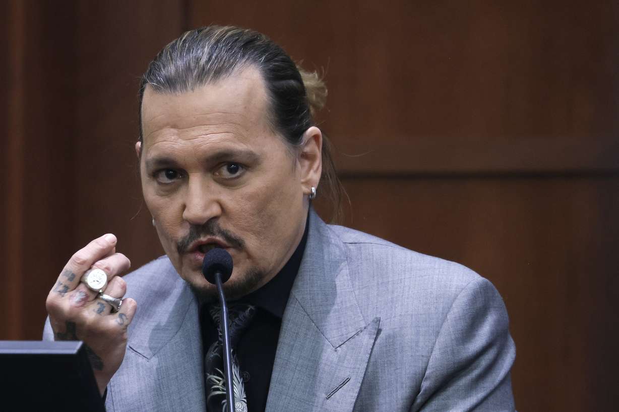 Actor Johnny Depp testifies during a hearing in the courtroom at the Fairfax County Circuit Court in Fairfax, Va., Wednesday.