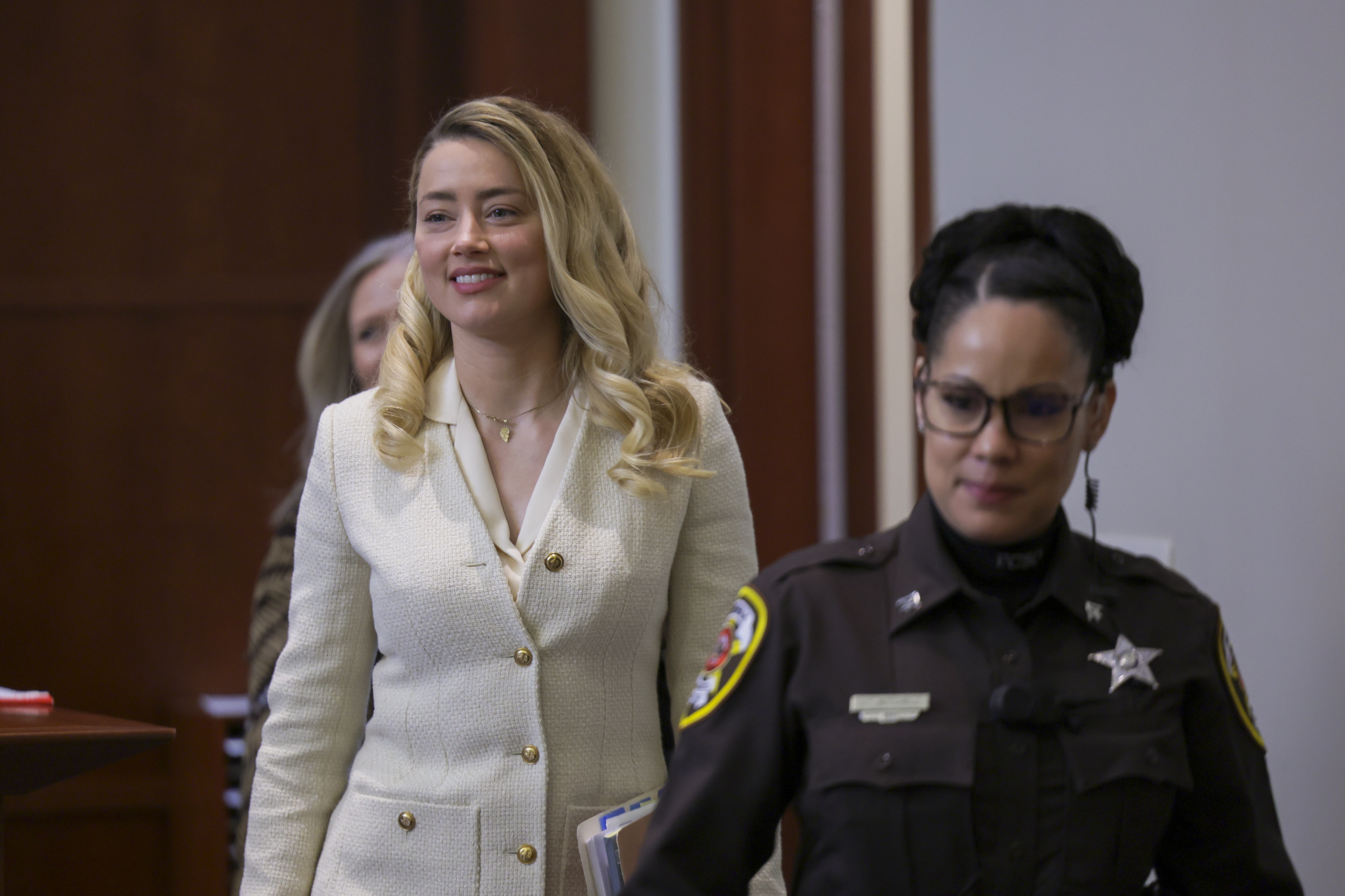 Actress Amber Heard arrives in the courtroom at the Fairfax County Circuit Court in Fairfax, Va., Wednesday.