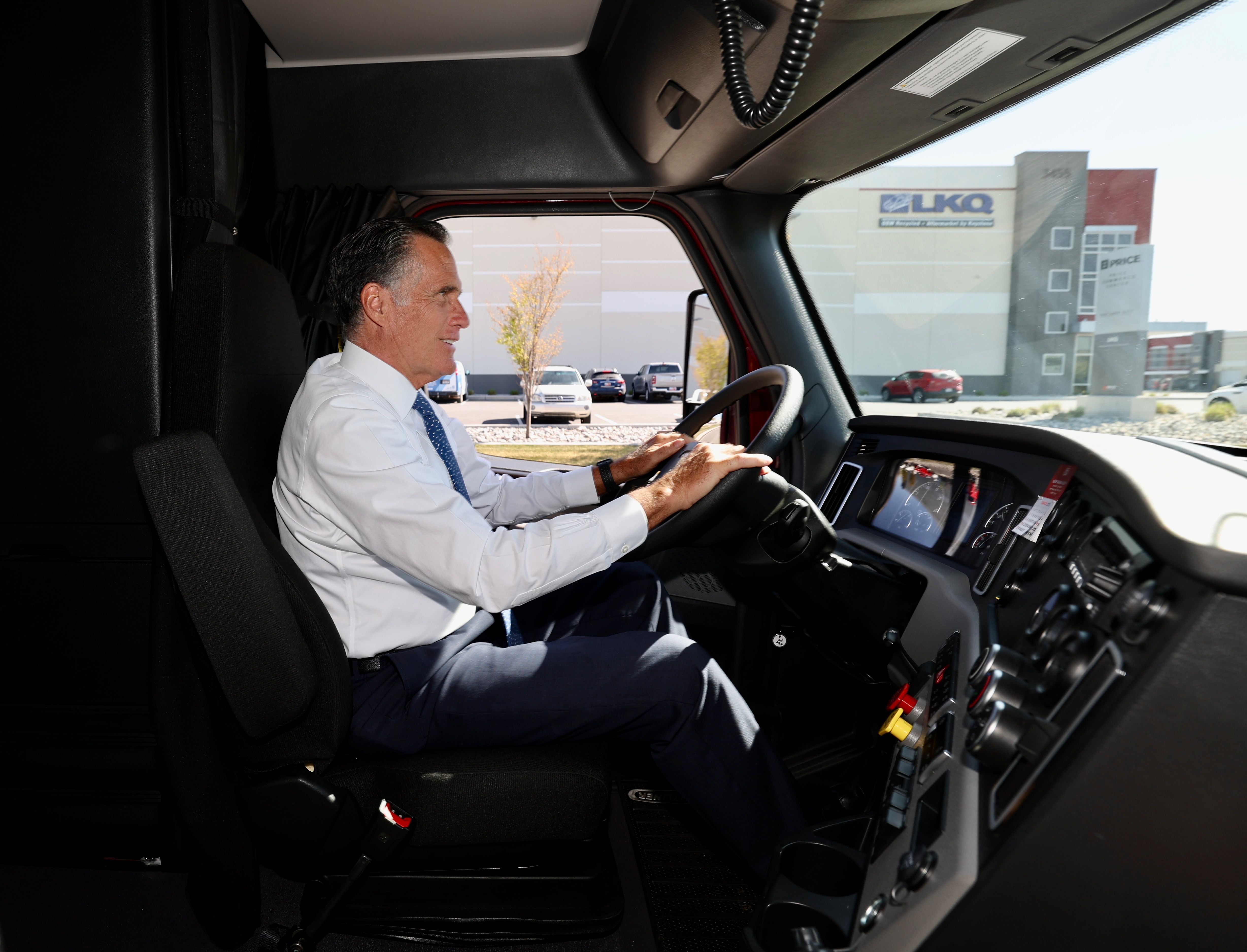 Sen. Mitt Romney, R-Utah, drives a Freightliner semi from Double D Distribution in Salt Lake City on Wednesday.