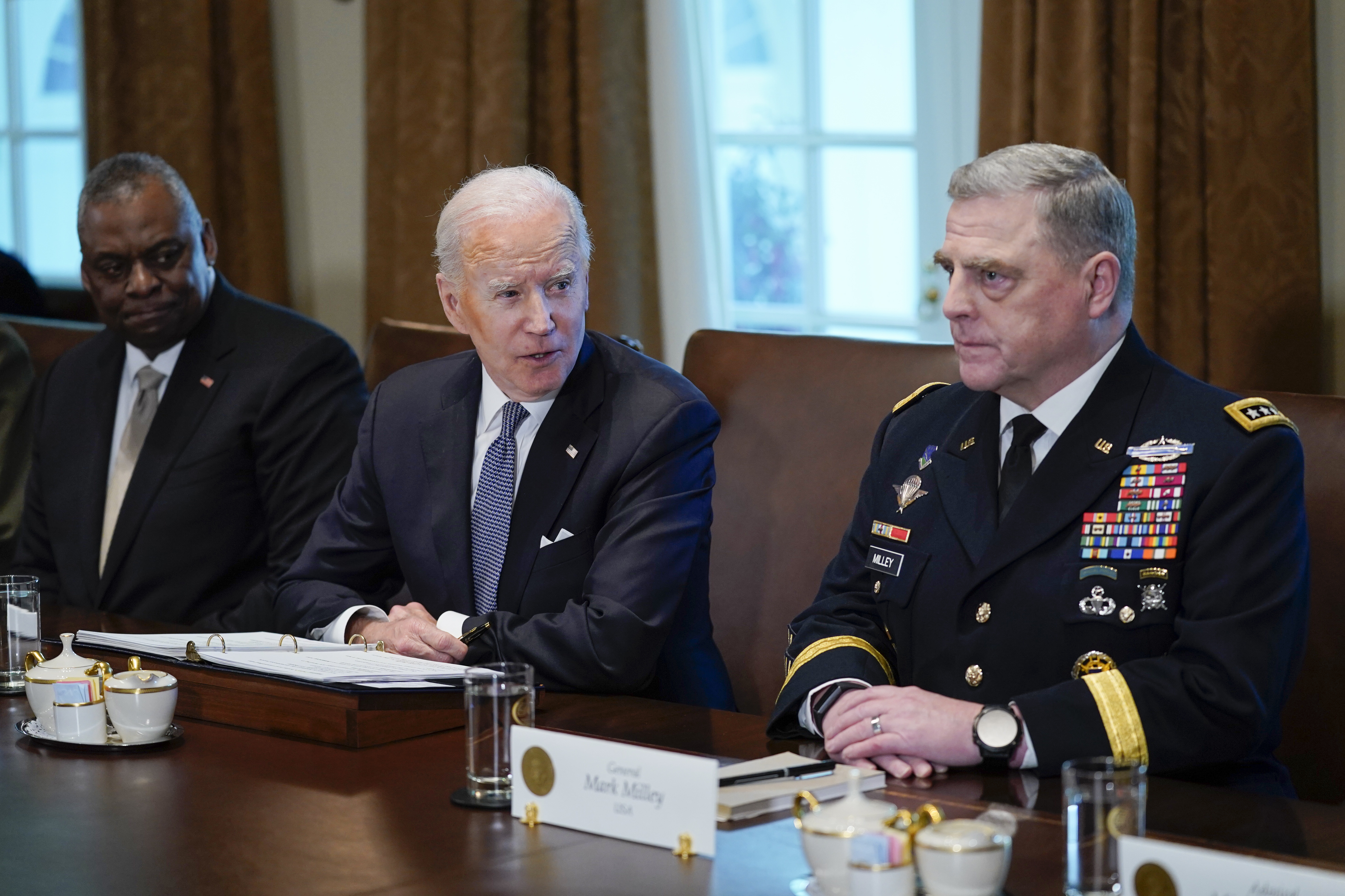President Joe Biden listens during a meeting with Secretary of Defense Lloyd Austin, left, and Chairman of the Joint Chiefs of Staff Gen. Mark Milley, and other military leaders in the Cabinet Room the White House, Wednesday. On Thursday Biden announced he has approved an additional $800 million in military aid to help Ukraine.