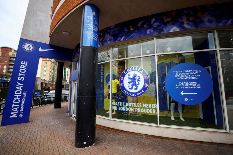 FILE PHOTO: A shop selling the merchandise of Chelsea Football Club is seen closed at Stamford Bridge after Britain imposed sanctions on its Russian owner, Roman Abramovich, in London, Britain, March 10, 2022.