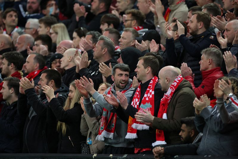 FILE PHOTO: Soccer Football - Premier League - Liverpool v Manchester United - Anfield, Liverpool, Britain - April 19, 2022 Liverpool fans applaud on the seventh minute for Manchester United 's Cristiano Ronaldo and his family