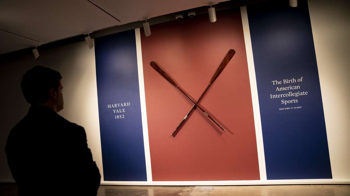 The Harvard-Yale Regatta 1852 Trophy Oars are displayed before an auction, Thursday, April 21, 2022, at Sotheby's in the Manhattan borough of New York. Sotheby's estimates the oars value between three and five million dollars. The oars were awarded to Harvard's winning crew and represent one of the oldest collegiate athletic competitions in the nation's history.