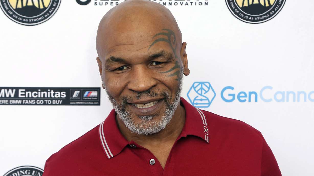 Mike Tyson attends a celebrity golf tournament in Dana Point, Calif. on Aug. 2, 2019. Authorities are investigating after cellphone video appears to show Mike Tyson hitting another passenger on a plane at San Francisco International Airport.