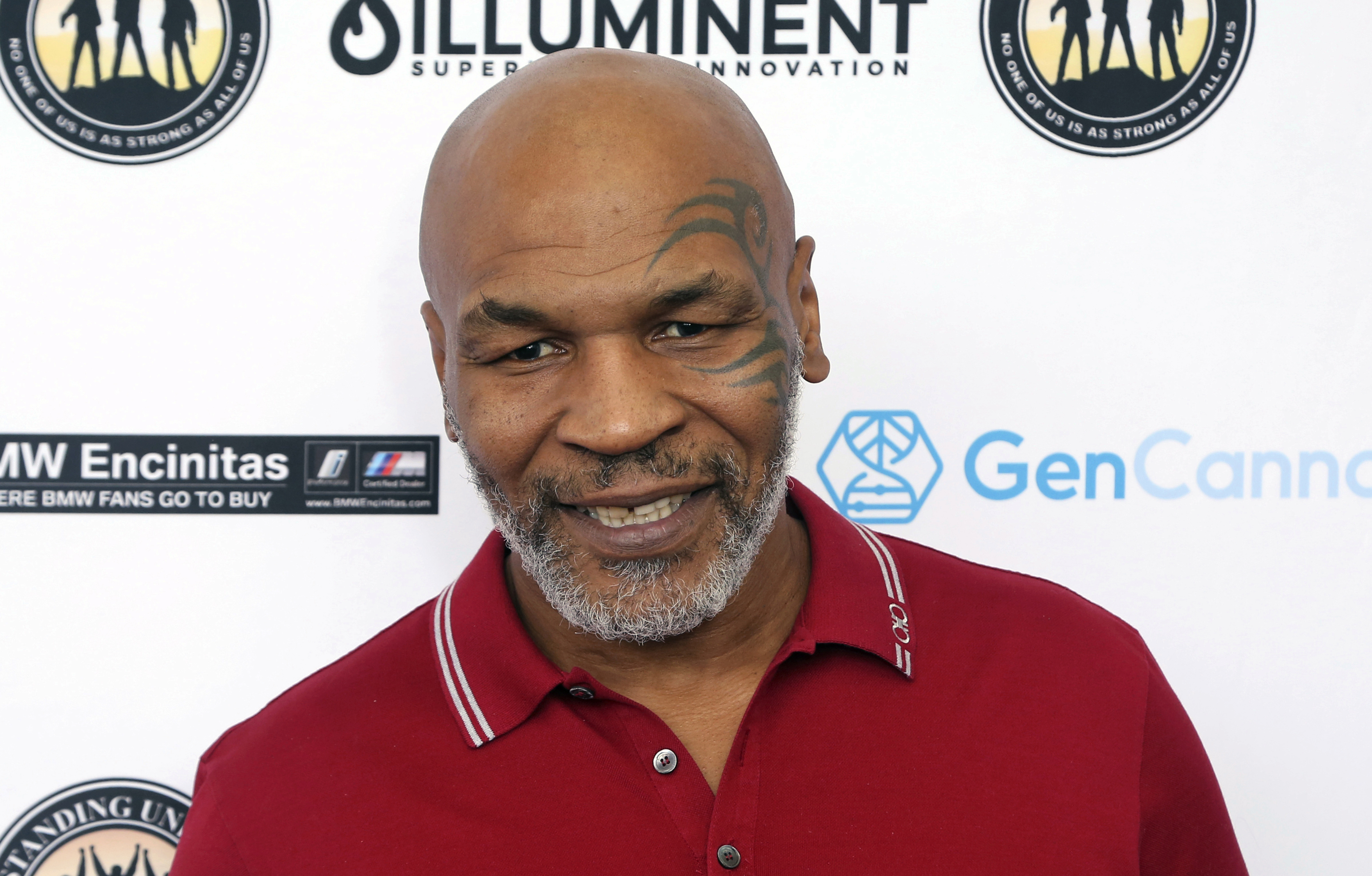 FILE - In this Aug. 2, 2019 photo, Mike Tyson attends a celebrity golf tournament in Dana Point, Calif. Authorities are investigating after cellphone video appears to show Mike Tyson hitting another passenger on a plane at San Francisco International Airport. 