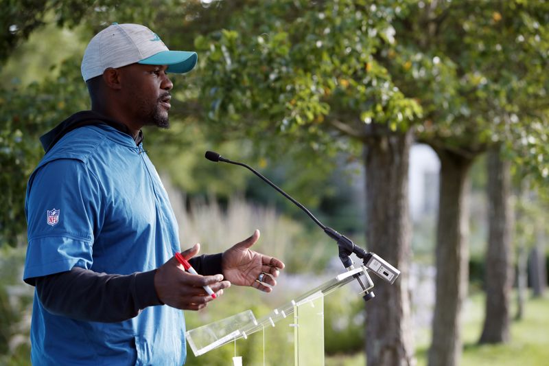FILE PHOTO: American Football - NFL - Miami Dolphins Media Day - Hanbury Manor Marriott Hotel & Country Club, Ware, Britain - October 15, 2021 Miami Dolphins' Brian Flores during a press conference