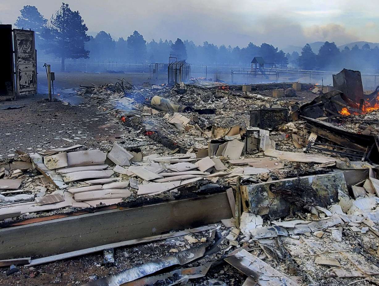 This Wednesday photo provided by Bill Wells shows his home on the outskirts of Flagstaff, Ariz., destroyed by a wildfire on Tuesday.