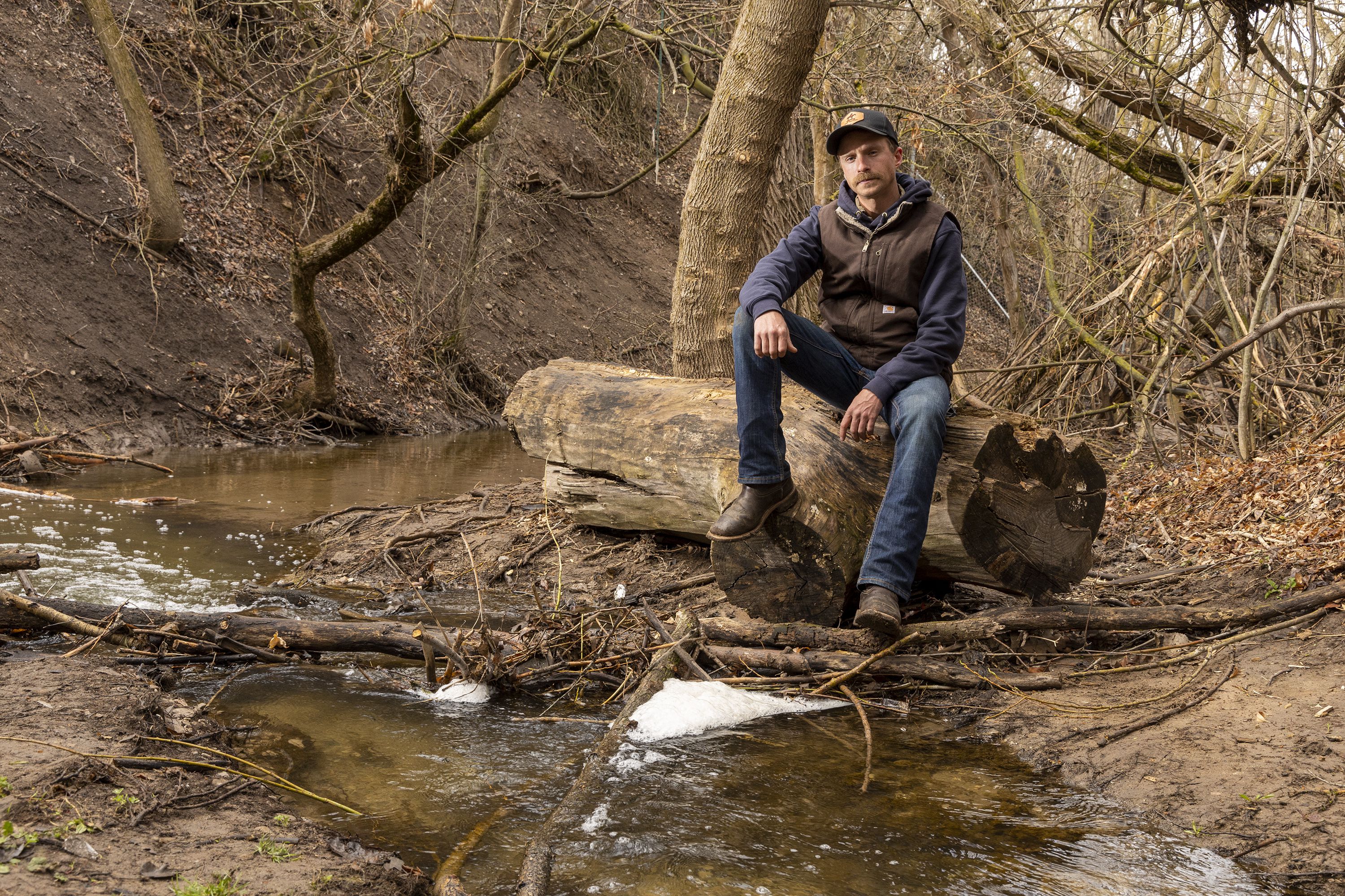 Will Munger, a doctoral student at Utah State University in the Department of Environment and Society, poses for a photo along Emigration Creek in Wasatch Hollow Preserve in Salt Lake City on April 15.